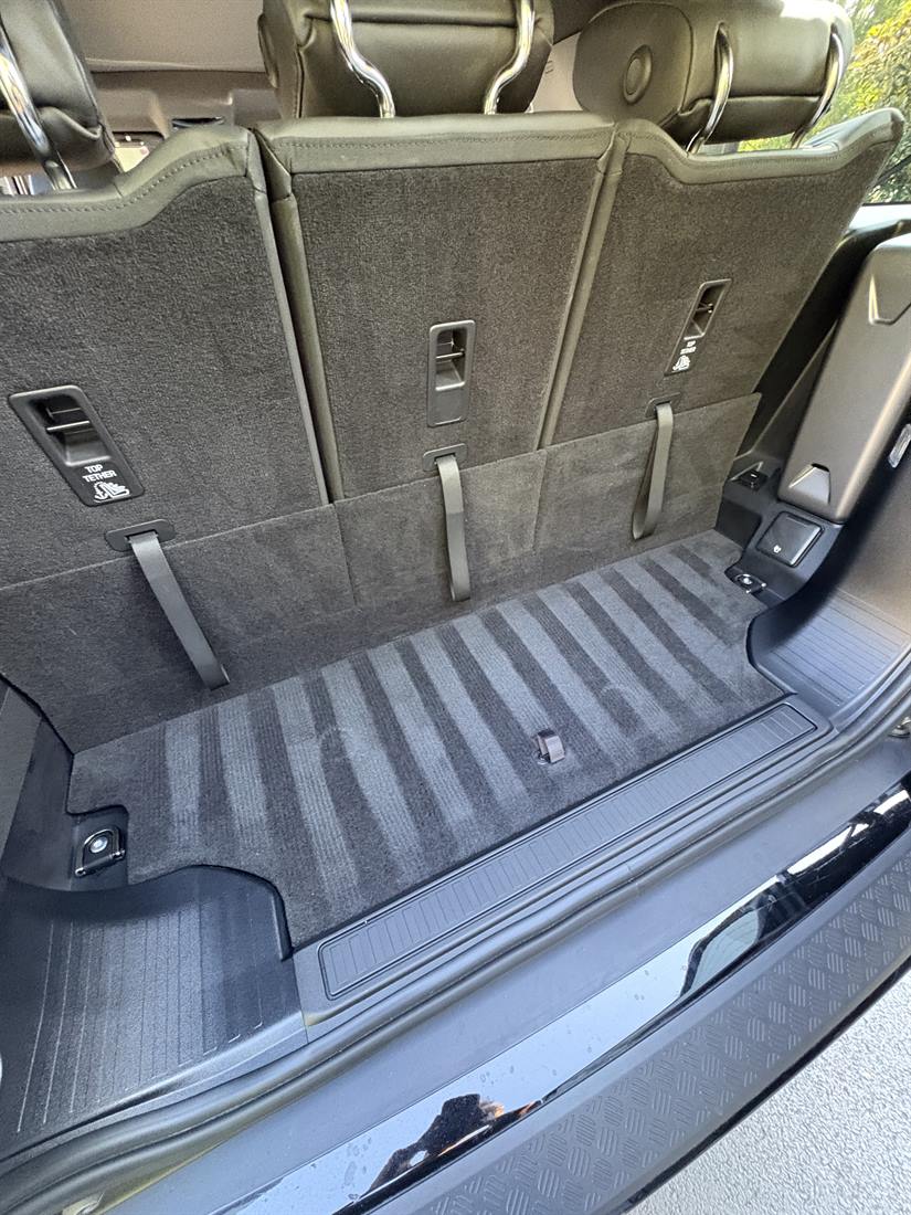 Freshly vacuumed cargo carpet showing clean nap lines