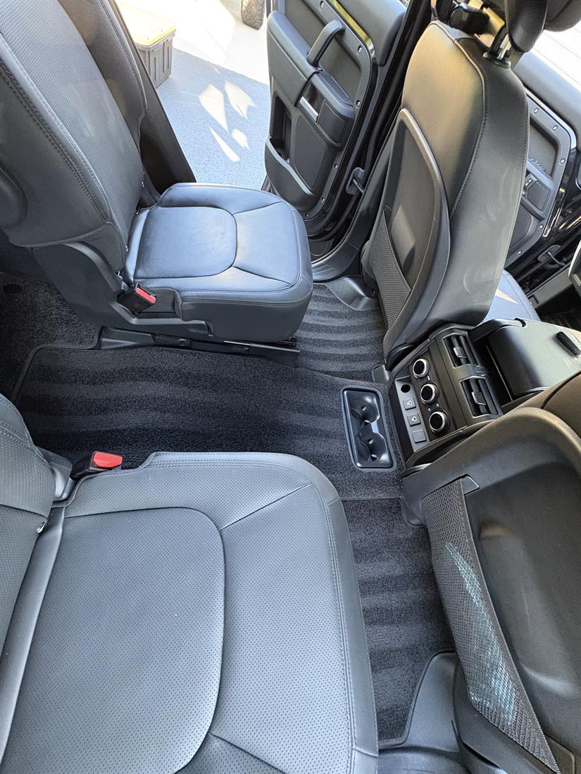 Clean rear seats and vacuumed carpet after an interior detail