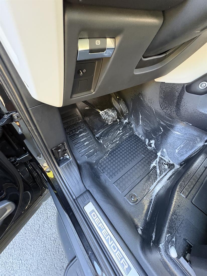 Cleaner worked into the floor mats during an interior detail